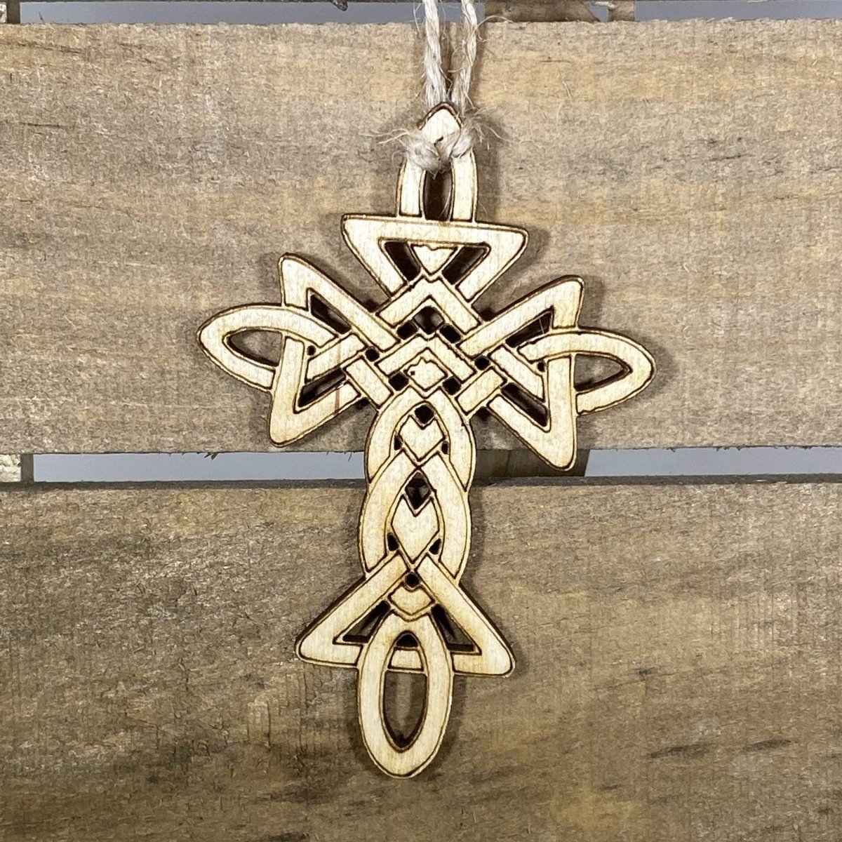 Hand-painted wooden Celtic cross Christmas ornament featuring an intricate knotwork design with traditional religious symbolism, meaningful holiday decor for Christian homes and Celtic heritage enthusiasts by Cate’s Concepts