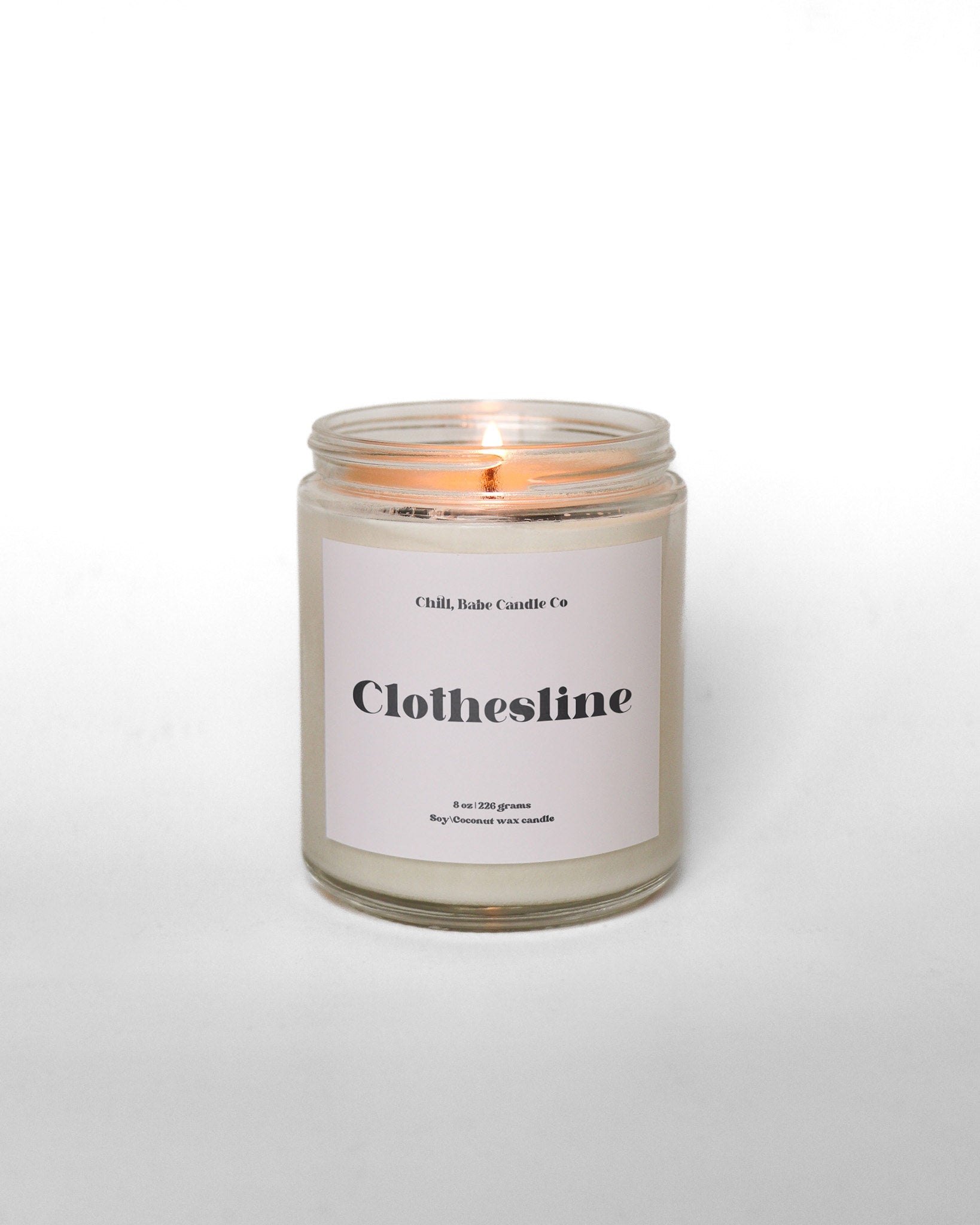 clothesline candle in front of a white background