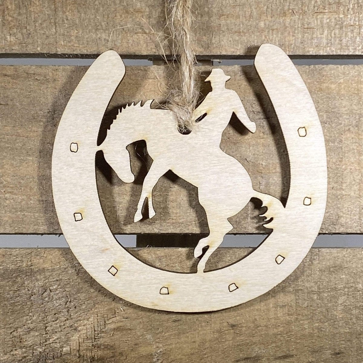 Hand-painted wooden cowboy horseshoe Christmas ornament featuring a rustic Western horseshoe design with engraved detailing and frontier charm, festive holiday decor for cowboys and Western lifestyle enthusiasts by Cate’s Concepts