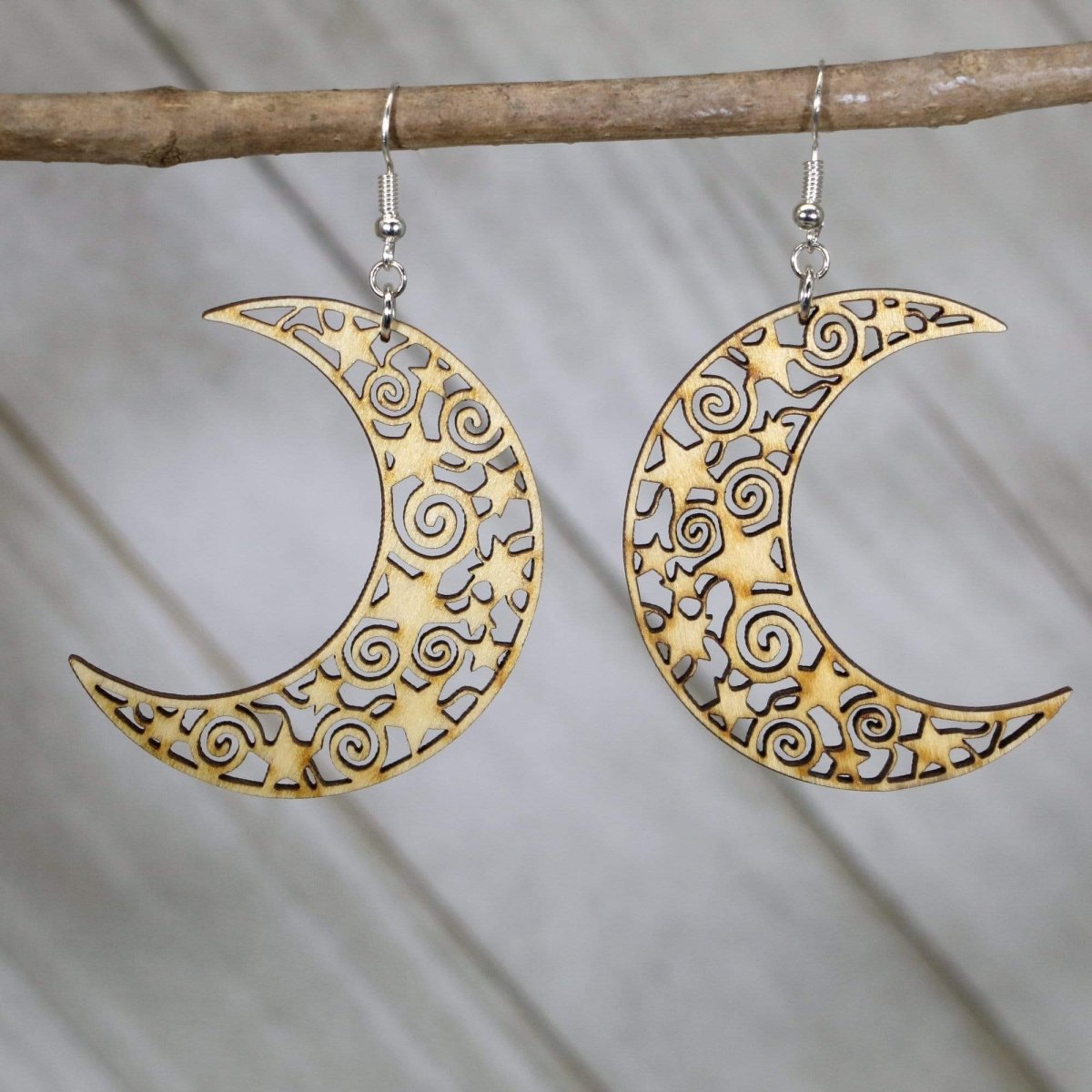 Hand-painted wooden crescent moon dangle earrings with celestial filigree design and hypoallergenic sterling silver hooks, lightweight moon statement jewelry earrings for mystical boho and lunar style