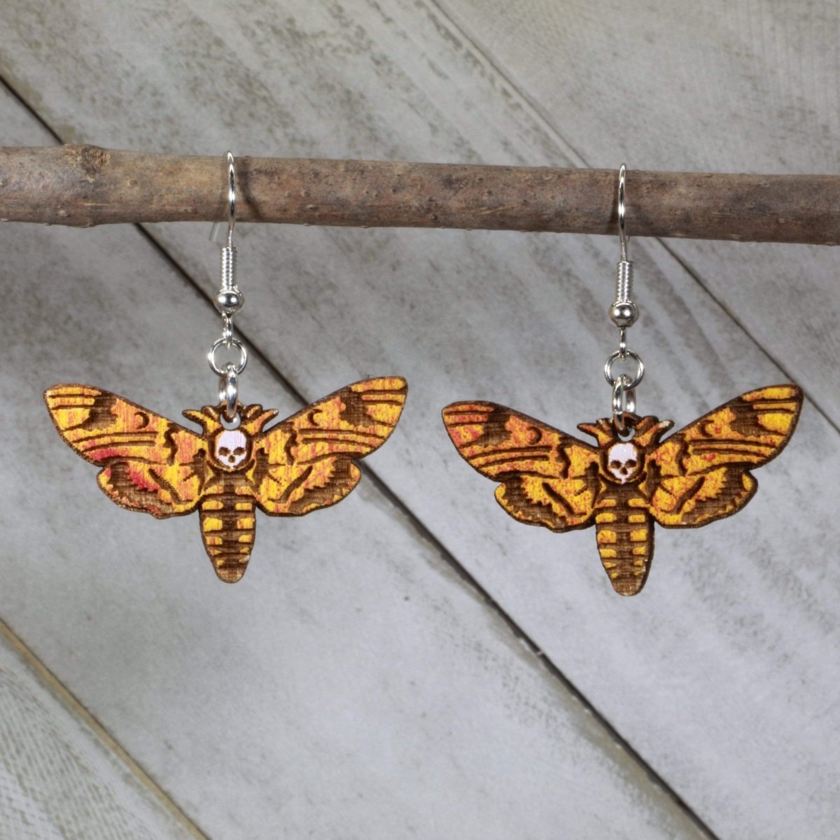 Hand-painted wooden death head hawkmoth dangle earrings with gothic insect skull design and hypoallergenic sterling silver hooks, lightweight hawkmoth statement jewelry earrings for dark aesthetic style