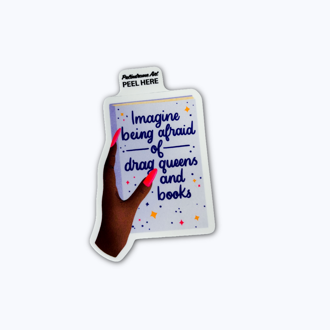 Sticker with a hand holding a book with text and a dark skin tone hand with red nails with text "imagine being afraid of drag queens and books"