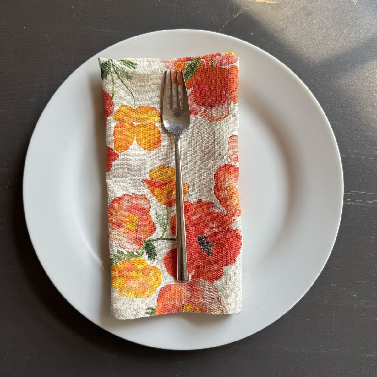 European Linen napkin with an Ember Poppies pattern on cream