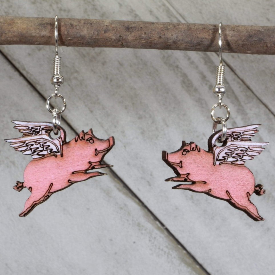 Hand-painted wooden flying pig dangle earrings with whimsical realistic pig design and hypoallergenic sterling silver hooks, quirky farm animal statement jewelry earrings