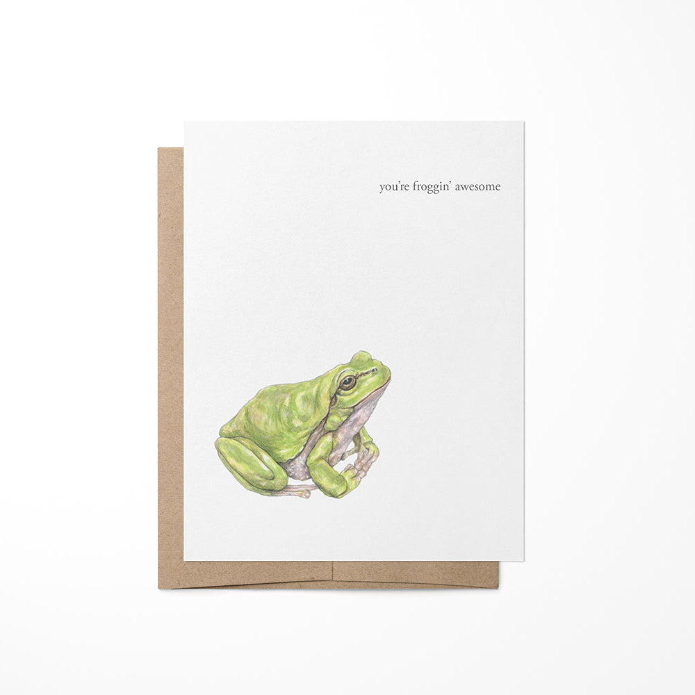 Greeting card featuring a watercolor illustration of a green frog on a white background