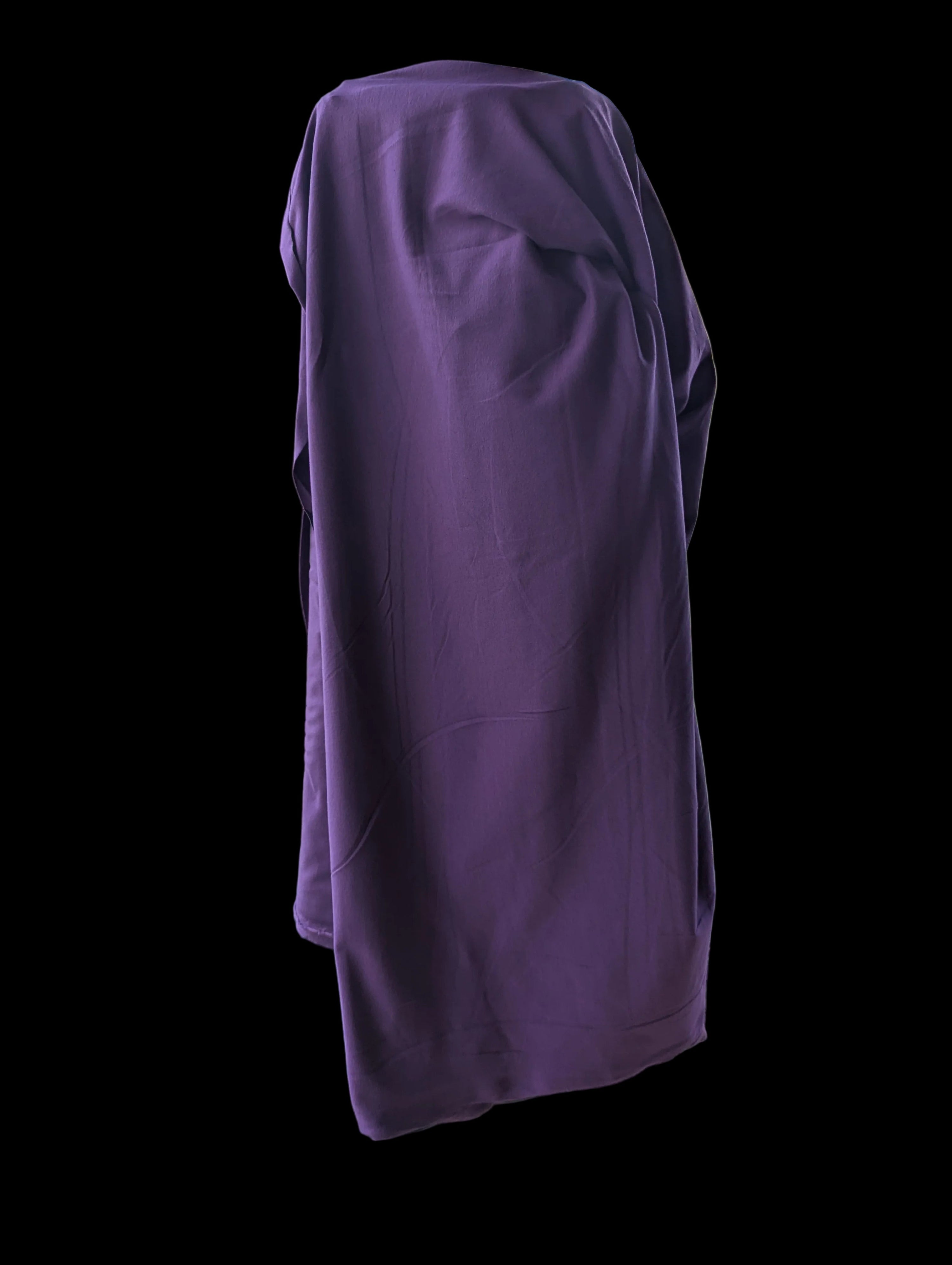 Solid purple cotton spandex fabric draping from the bolt