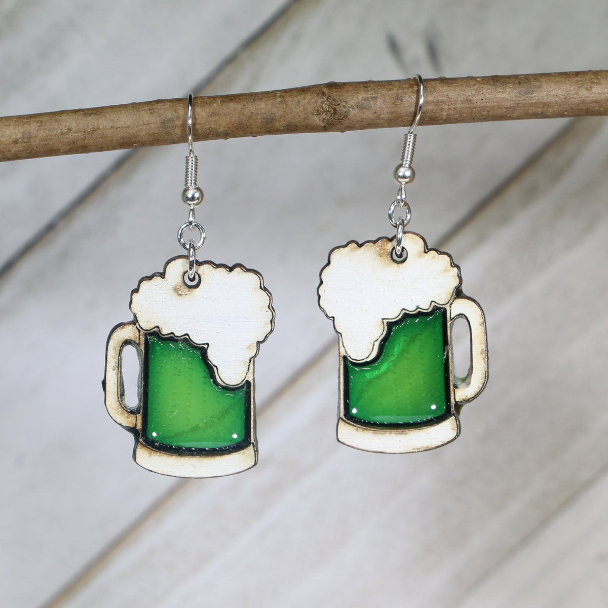 Hand-painted wooden green beer mug dangle earrings with festive St. Patrick’s Day design and hypoallergenic sterling silver hooks, lightweight novelty jewelry for bar crawls and Irish celebrations by Cate’s Concepts
