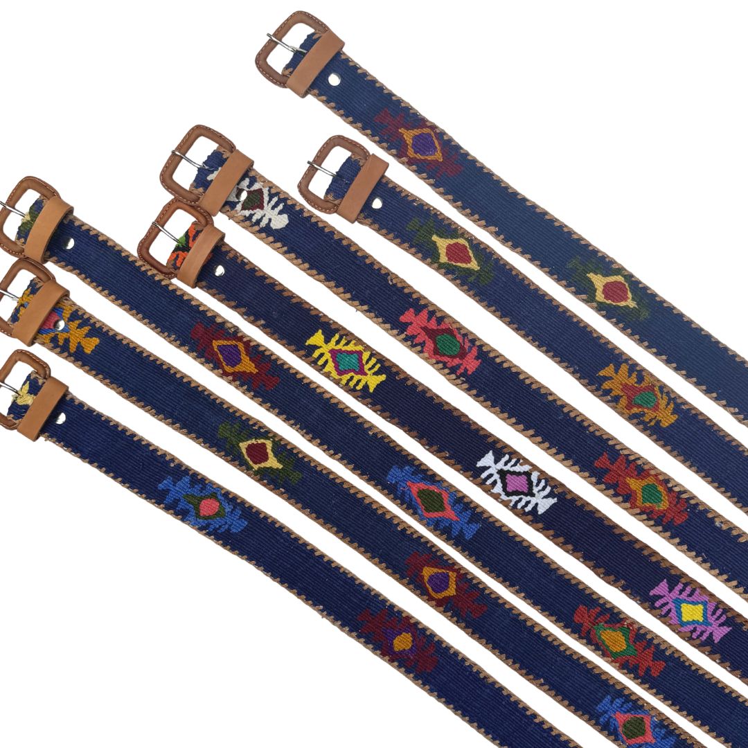 Set of blue belts with colorful patterns and brass buckles on a white background