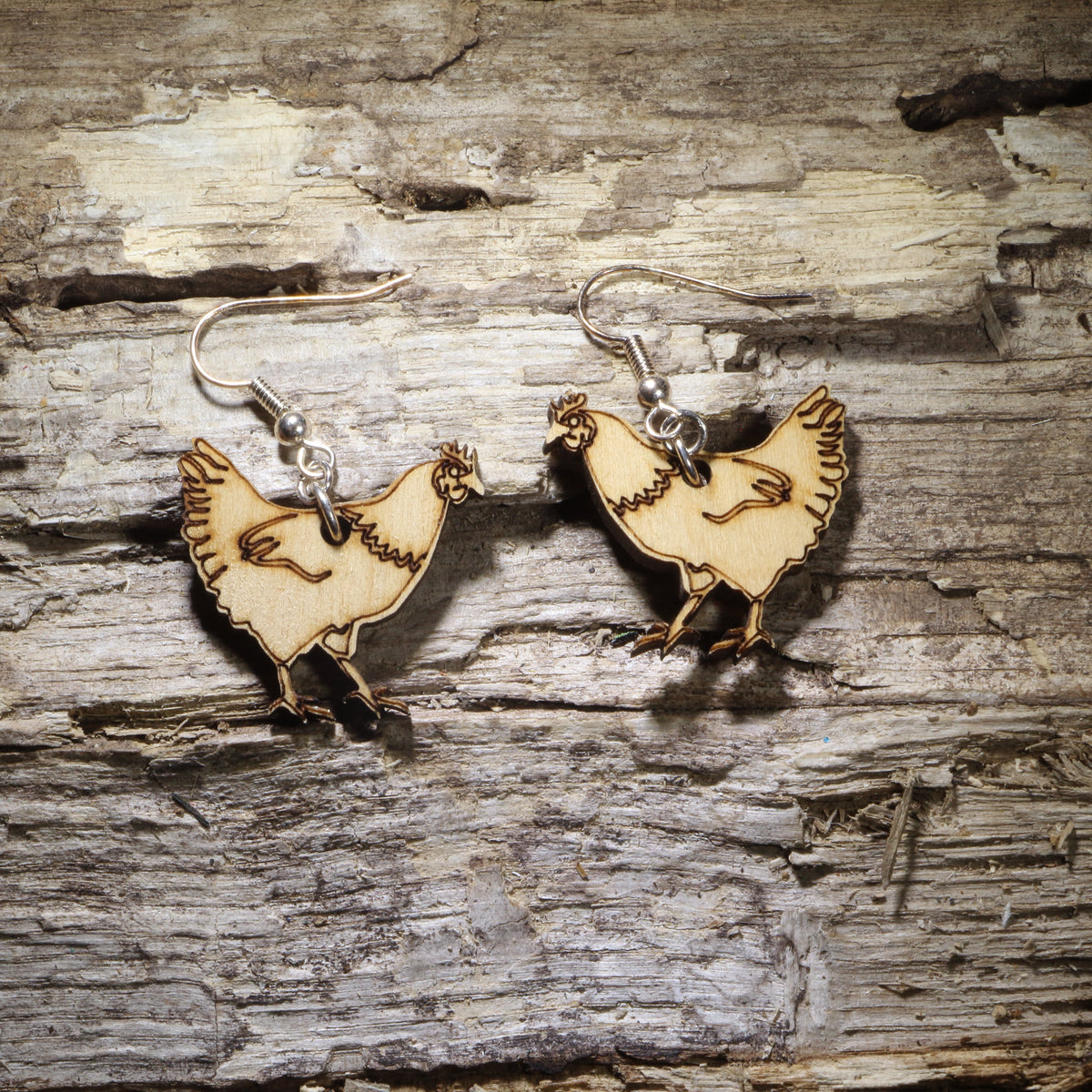 Hand-painted wooden chicken dangle earrings featuring detailed hen silhouettes on lightweight wood with hypoallergenic .925 sterling silver hooks. Perfect for chicken lovers, backyard chicken keepers, poultry farmers, homesteaders, farm animal enthusiasts, and unique country-inspired jewelry.