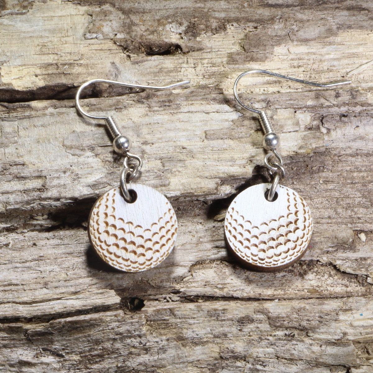 Hand-painted wooden golf ball dangle earrings featuring realistic engraved dimples on hypoallergenic .925 sterling silver hooks. Lightweight golf jewelry for golfers, golf coaches, country club members, tournament gifts, and golf enthusiasts.
