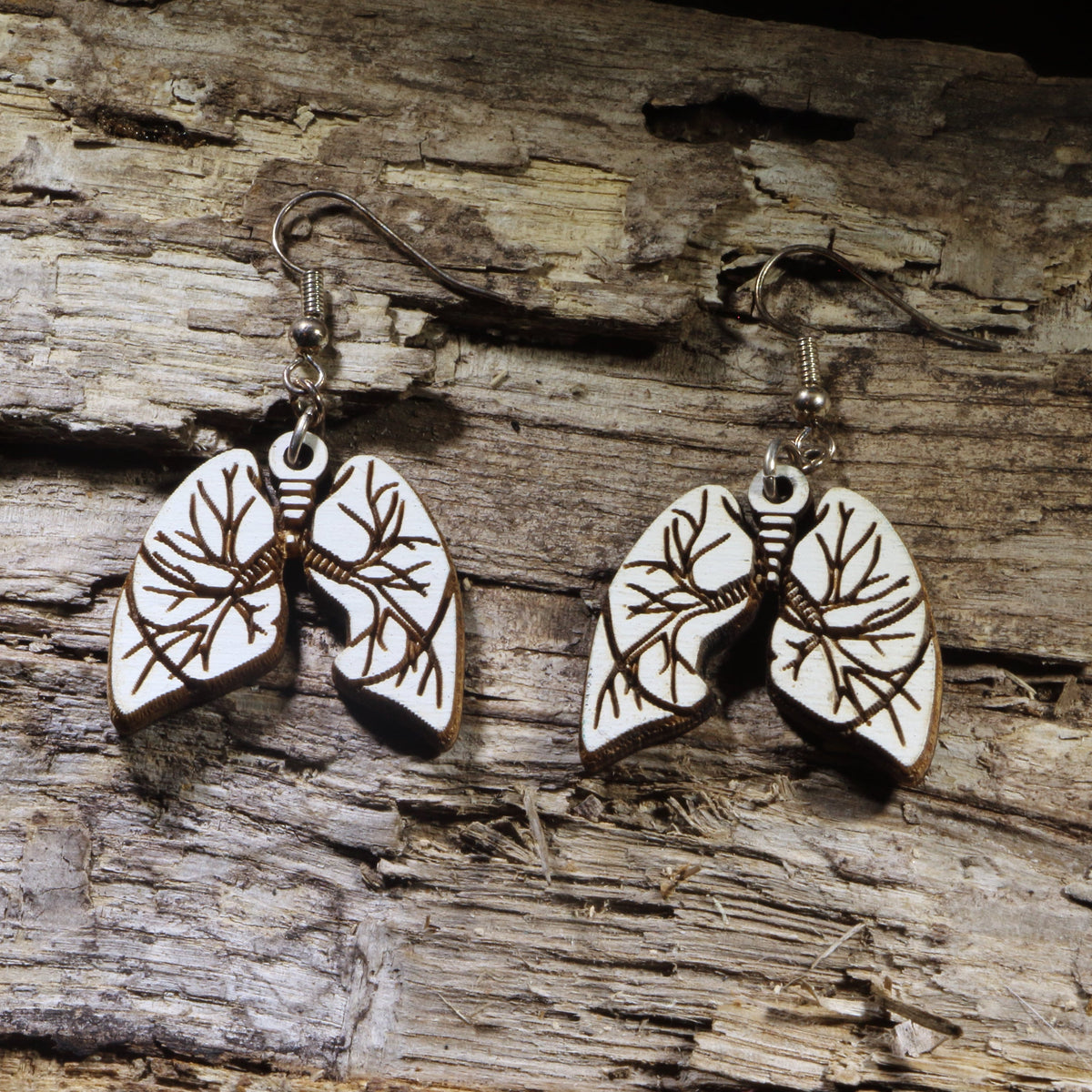 Hand-painted wooden lung dangle earrings featuring an anatomically inspired lung design with engraved bronchi details. Lightweight medical earrings with hypoallergenic .925 sterling silver hooks, perfect for respiratory therapists, pulmonologists, nurses, doctors, medical students, anatomy enthusiasts, and healthcare professionals who appreciate unique handmade jewelry.