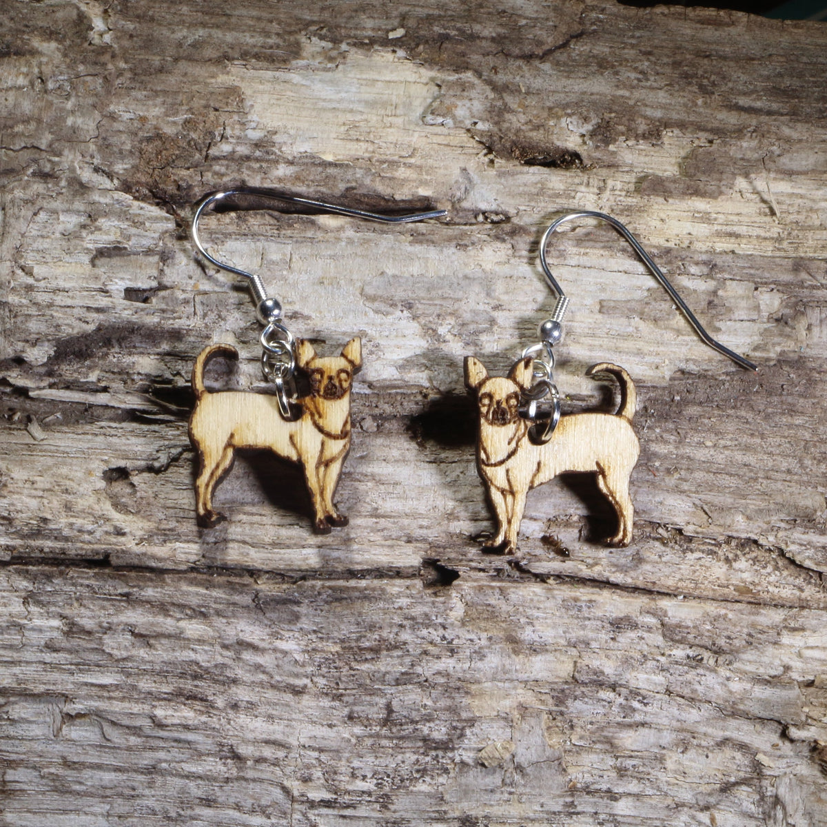 Handmade Chihuahua wooden dangle earrings featuring adorable hand-painted Chihuahua dogs with detailed facial features. Lightweight dog lover earrings crafted from wood with hypoallergenic .925 sterling silver hooks, perfect for Chihuahua owners, pet parents, dog lovers, toy breed enthusiasts, and unique handmade animal jewelry.
