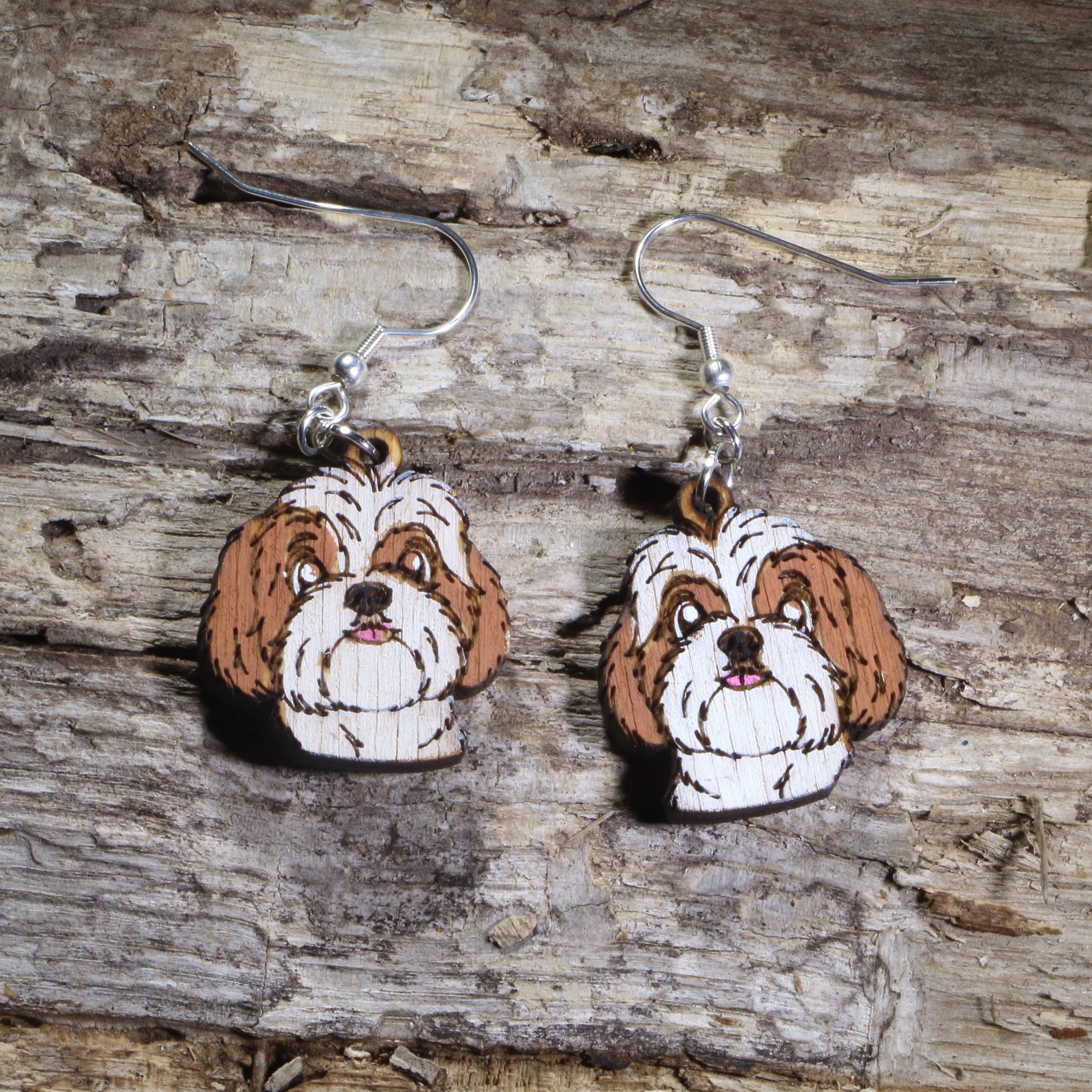Handmade Shih Tzu wooden dangle earrings featuring adorable hand-painted Shih Tzu dogs with detailed facial features. Lightweight dog lover earrings crafted from wood with hypoallergenic .925 sterling silver hooks, perfect for Shih Tzu owners, pet parents, dog lovers, toy breed enthusiasts, and unique handmade animal jewelry.