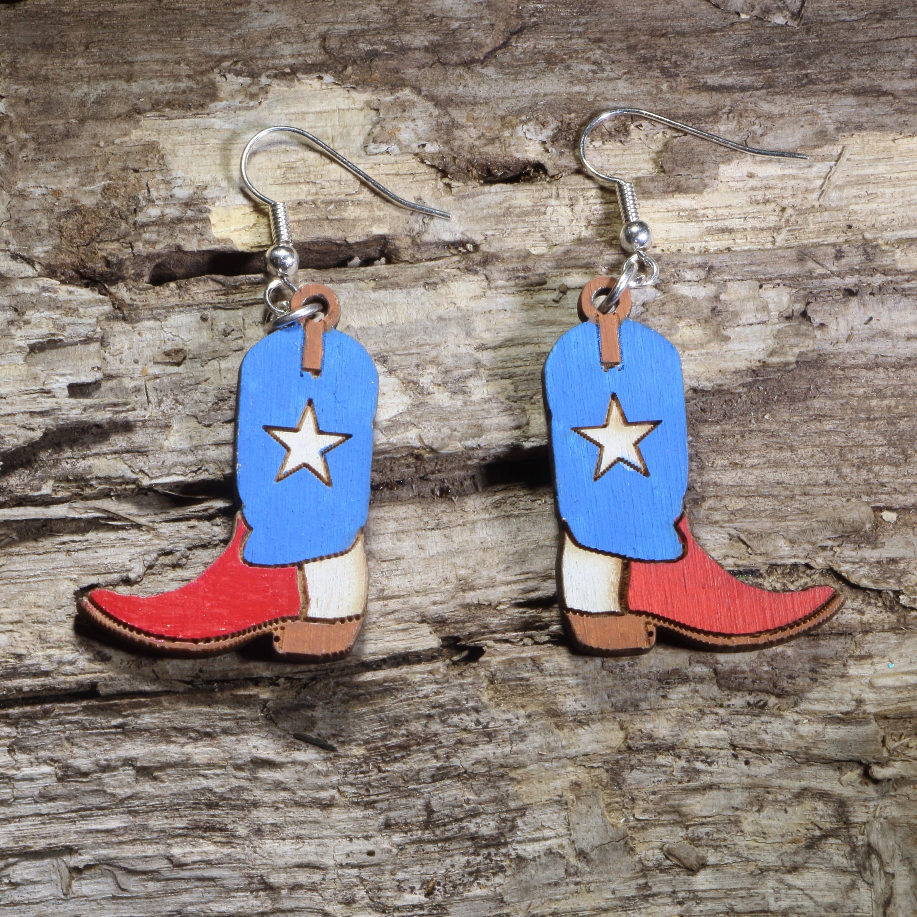 Handmade Texas Lone Star cowboy boot wooden dangle earrings featuring classic western boots with a bold Lone Star design. Lightweight Texas earrings crafted from wood with hypoallergenic .925 sterling silver hooks, perfect for Texas pride, western fashion, country music fans, rodeo enthusiasts, cowgirls, and unique cowboy jewelry collectors.