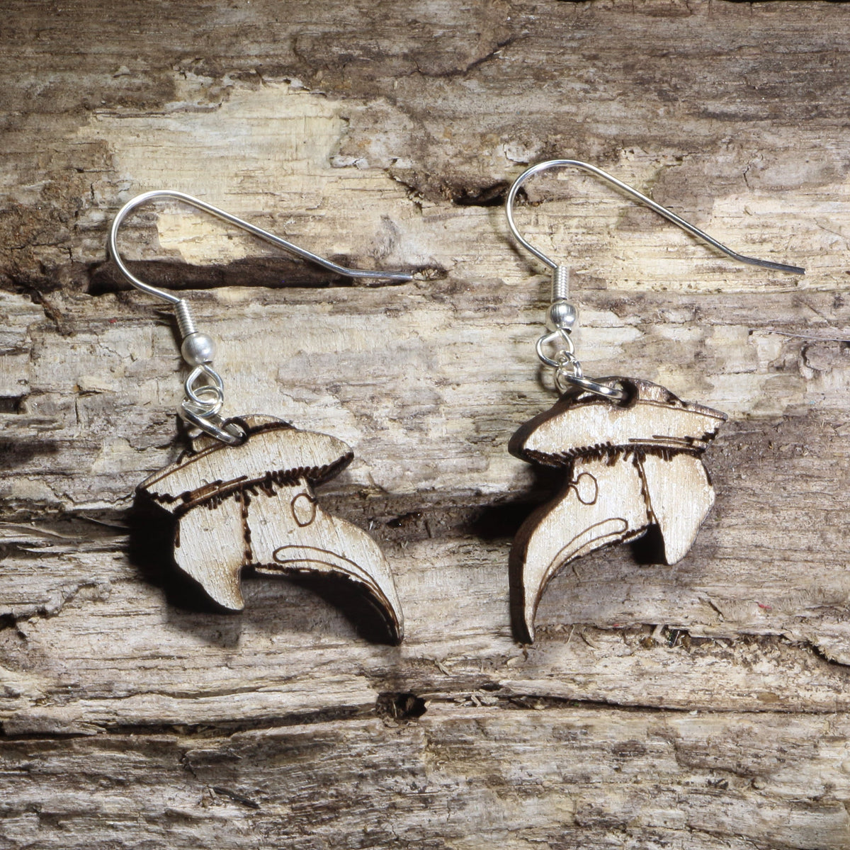 Handmade wooden plague doctor mask dangle earrings featuring the iconic beaked plague doctor mask with a wide-brimmed hat on hypoallergenic .925 sterling silver hooks. Lightweight gothic-inspired jewelry for horror fans, dark academia, Halloween, historical costume enthusiasts, and lovers of spooky accessories.