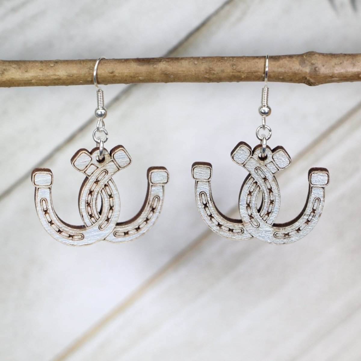 Hand-painted wooden horseshoe dangle earrings with western lucky charm design and hypoallergenic sterling silver hooks, lightweight horseshoe statement jewelry earrings for cowgirl style and good luck vibes