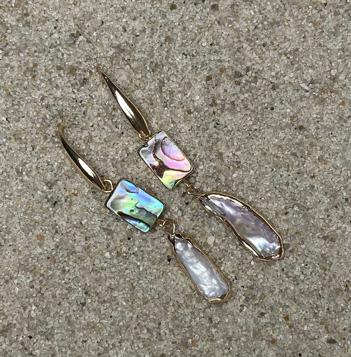 ocean springs rectangular abalone shell and organic freshwater pearl drop earrings on sand