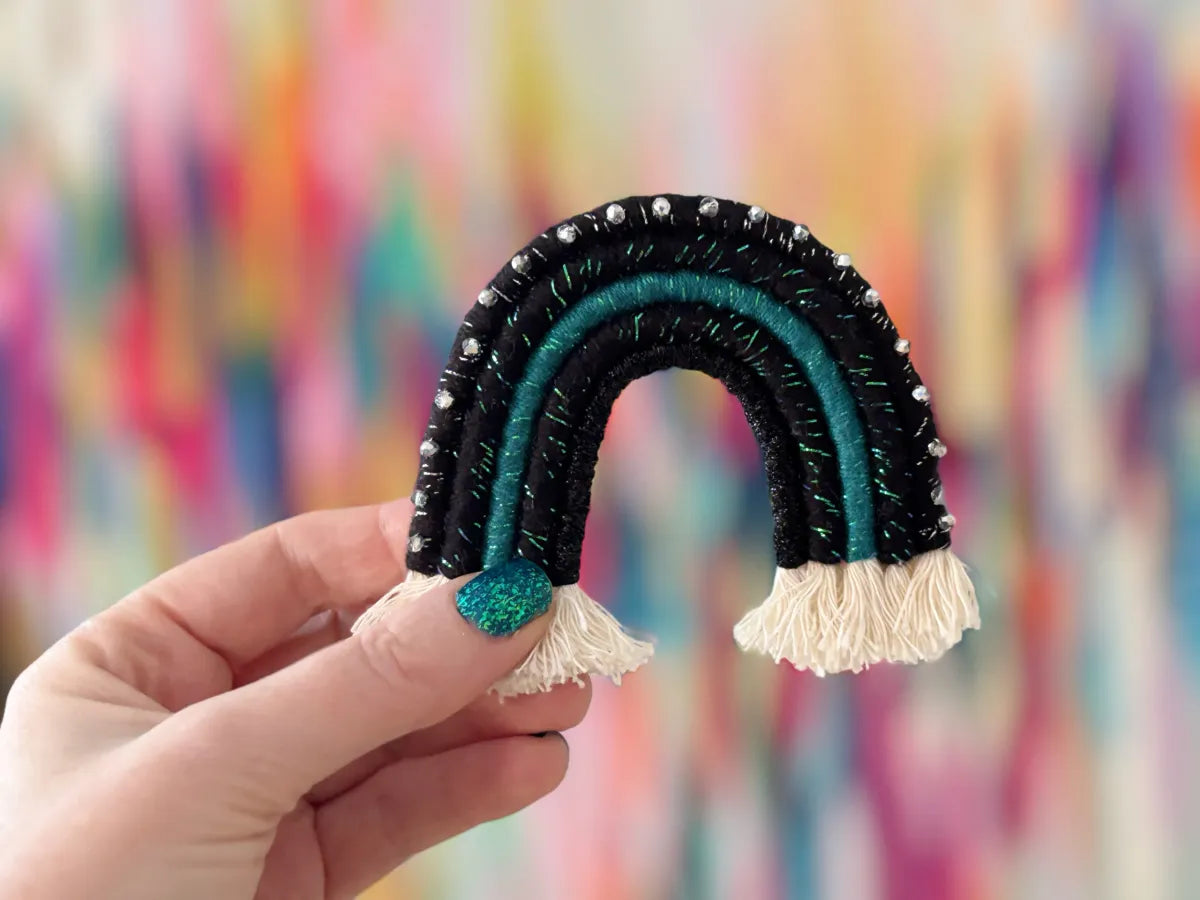 handmade black and teal fiber art rainbow