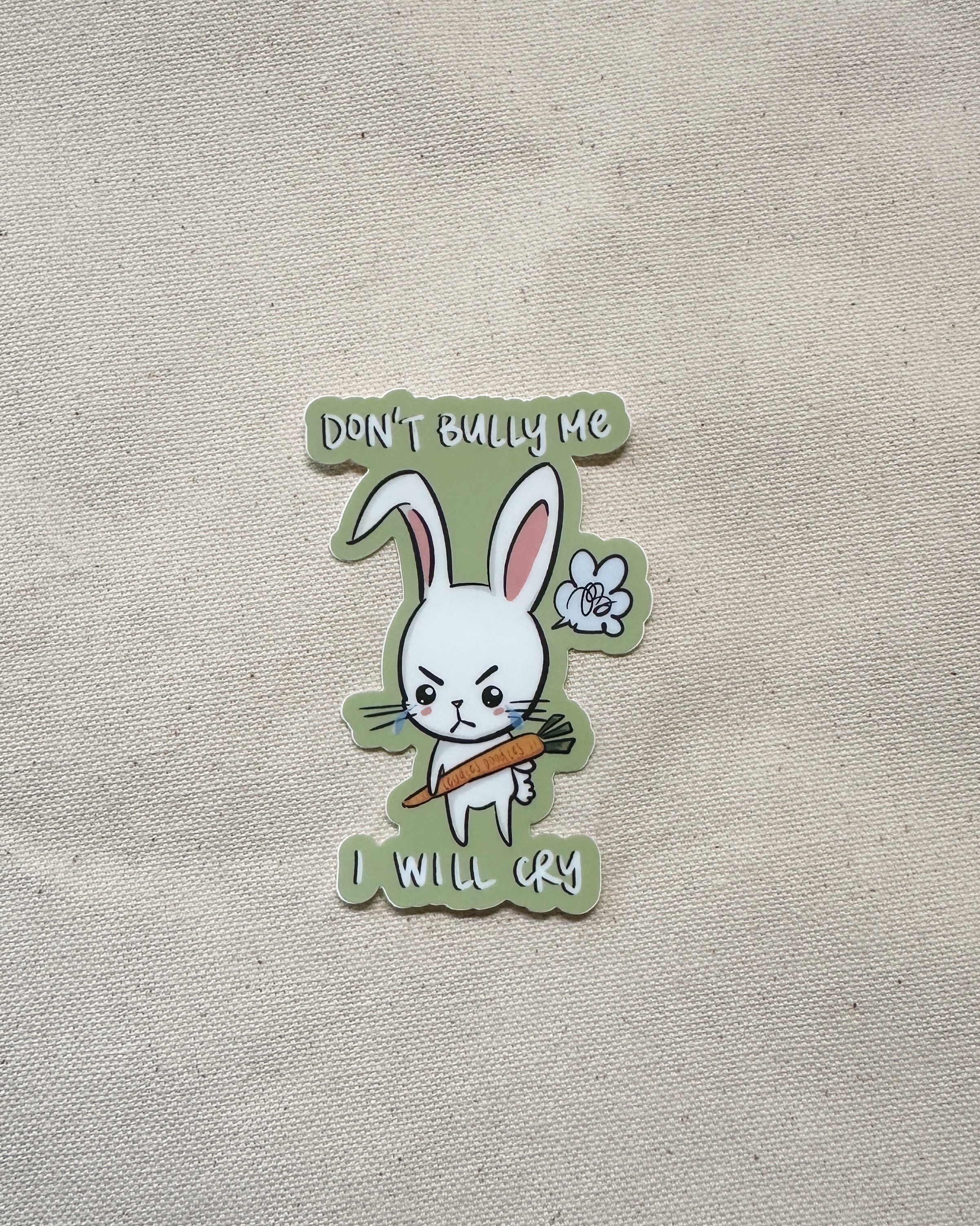 Sticker with a cartoon rabbit holding a carrot and text that says "Don&
