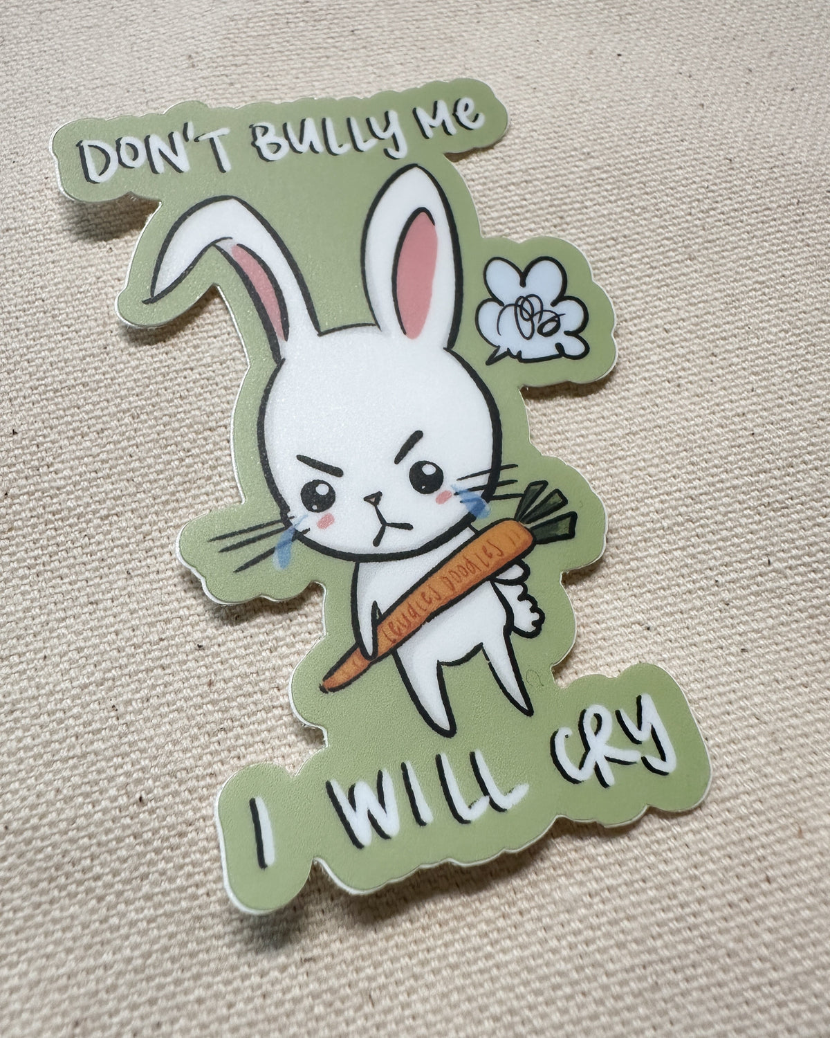 Sticker with a cartoon rabbit holding a carrot and text that says "Don&