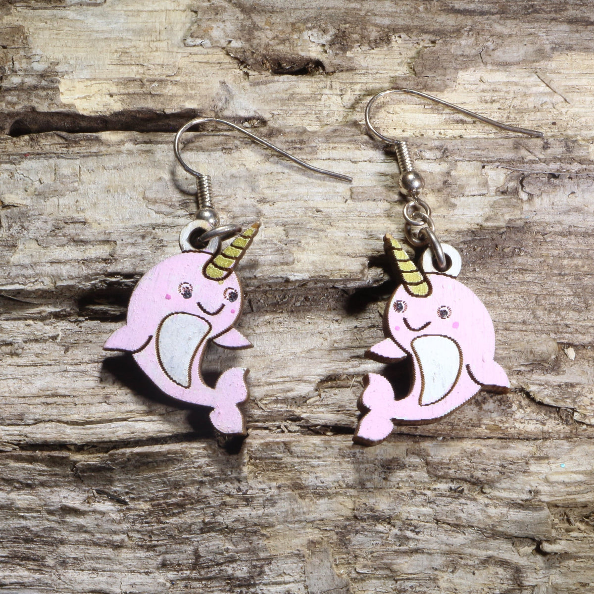 Handcrafted kawaii narwhal wooden dangle earrings featuring adorable smiling narwhals with colorful hand-painted details and signature tusks. Lightweight laser-cut wooden earrings with hypoallergenic .925 sterling silver hooks, perfect for ocean animal lovers, narwhal fans, kawaii fashion enthusiasts, marine life collectors, and cute handmade jewelry.