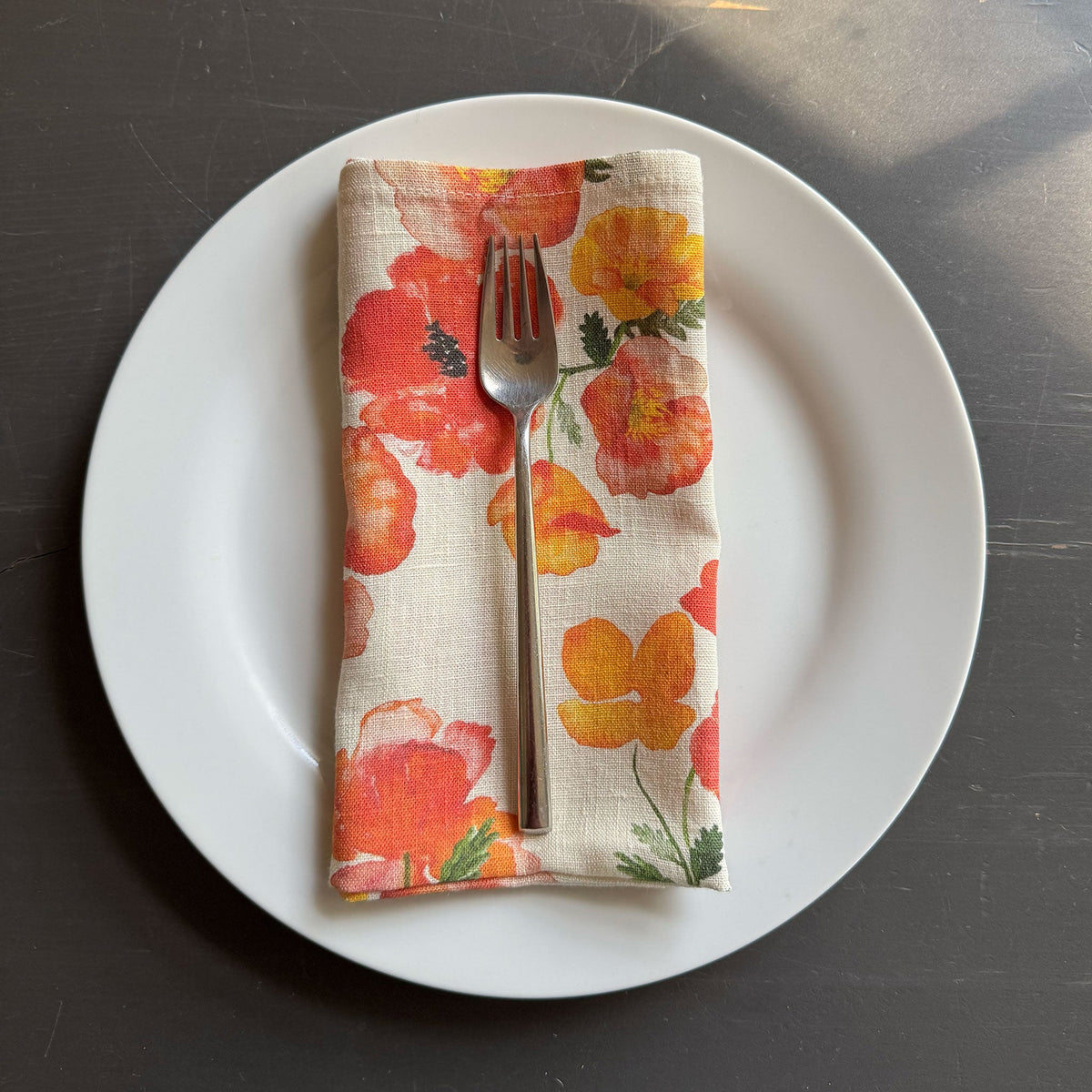 European Linen napkin with an Ember Poppies pattern on cream