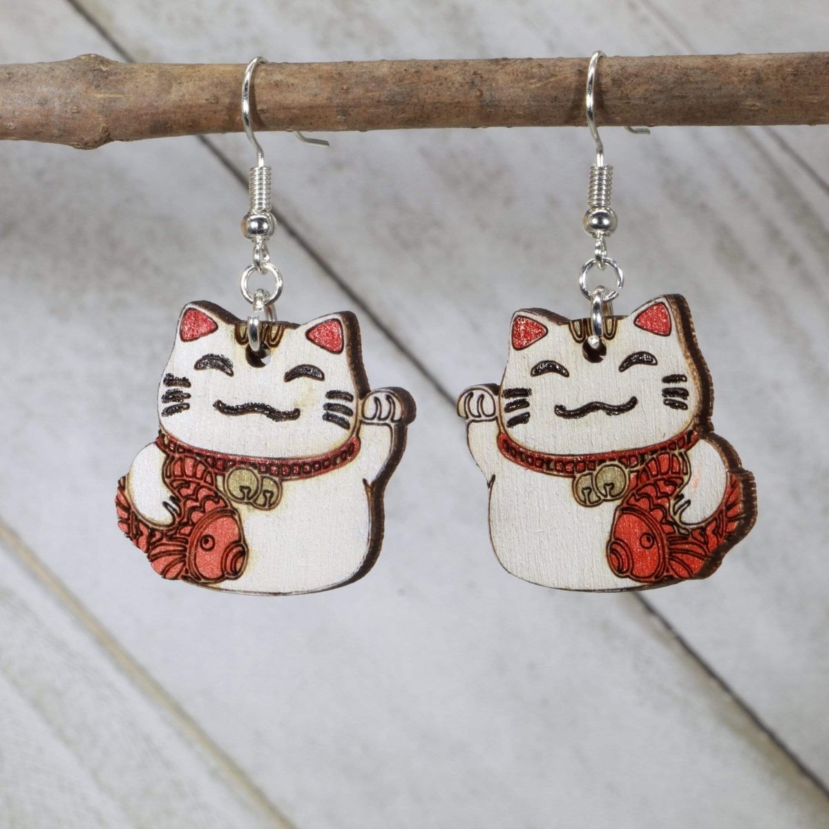 Hand-painted wooden lucky cat Maneki Neko dangle earrings with Japanese good luck design and hypoallergenic sterling silver hooks, lightweight lucky cat statement jewelry earrings for prosperity and kawaii style