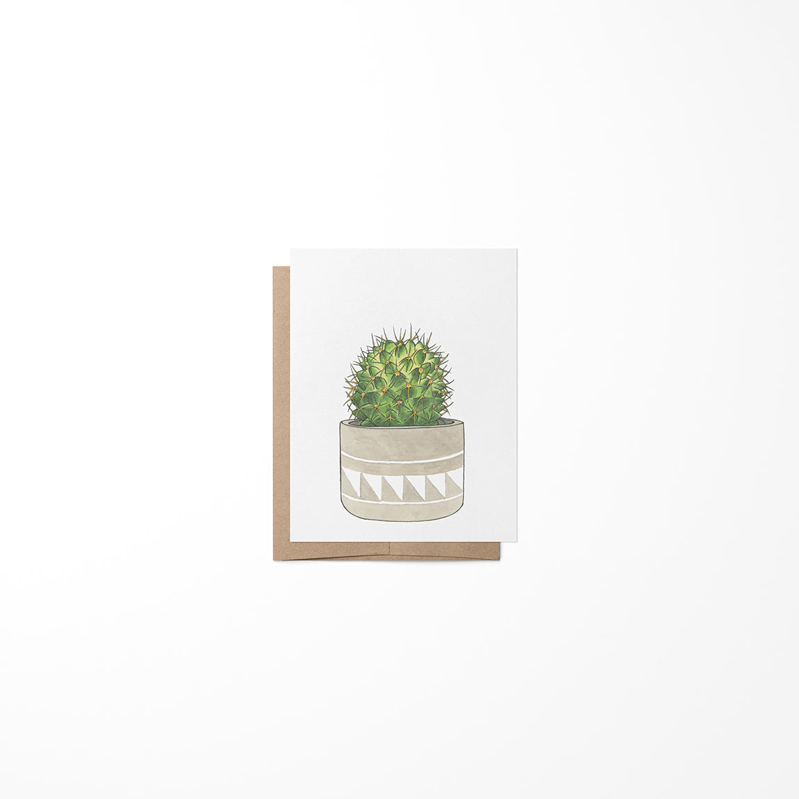 A greeting card with a round cactus illustration in a beige pot, made from heavy card stock paper.