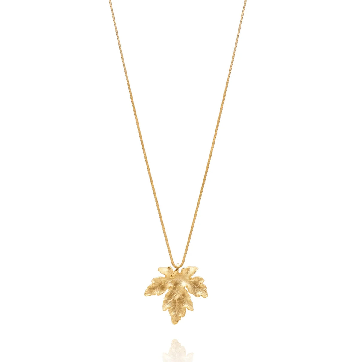 fair trade gold leaf pendant necklace made by hand, flat lay
