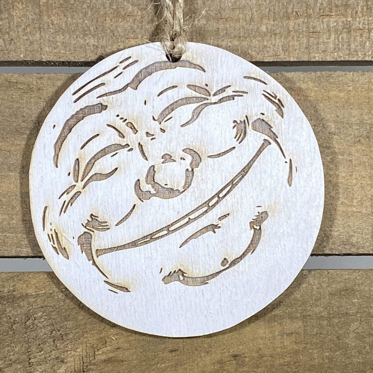 Hand-painted wooden moon face Christmas ornament featuring a celestial crescent moon with expressive facial details and whimsical design, festive holiday decor for stargazers and celestial theme lovers by Cate’s Concepts