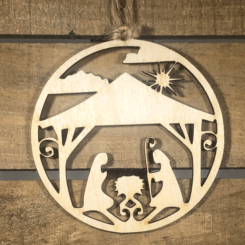 Hand-painted wooden nativity scene Christmas ornament featuring a detailed manger design with Mary, Joseph, and baby Jesus, meaningful holiday decor for Christian families and faith-centered celebrations by Cate’s Concepts