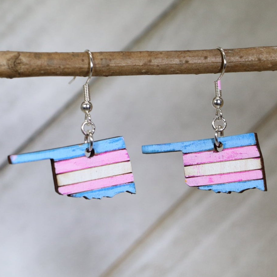 Hand-painted wooden Oklahoma trans pride dangle earrings with transgender pride color state design and hypoallergenic sterling silver hooks, lightweight LGBTQ statement jewelry earrings for Oklahoma pride and inclusive everyday style
