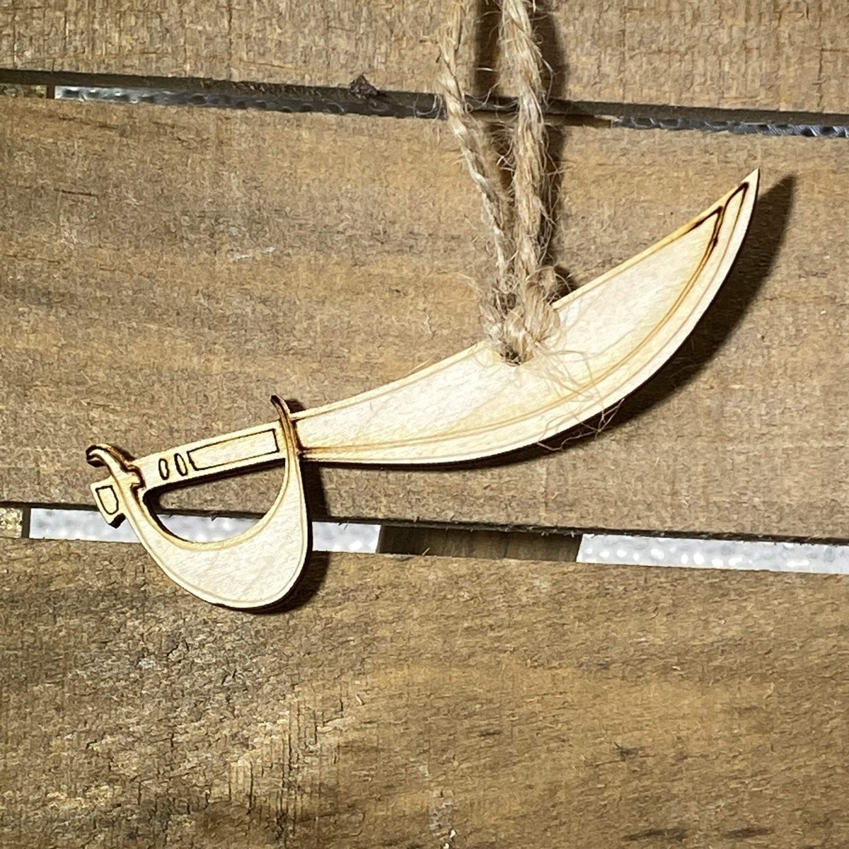 Hand-painted wooden pirate sword Christmas ornament with swashbuckling holiday design and lightweight festive decor, fun pirate-themed tree decoration for adventurous holiday style