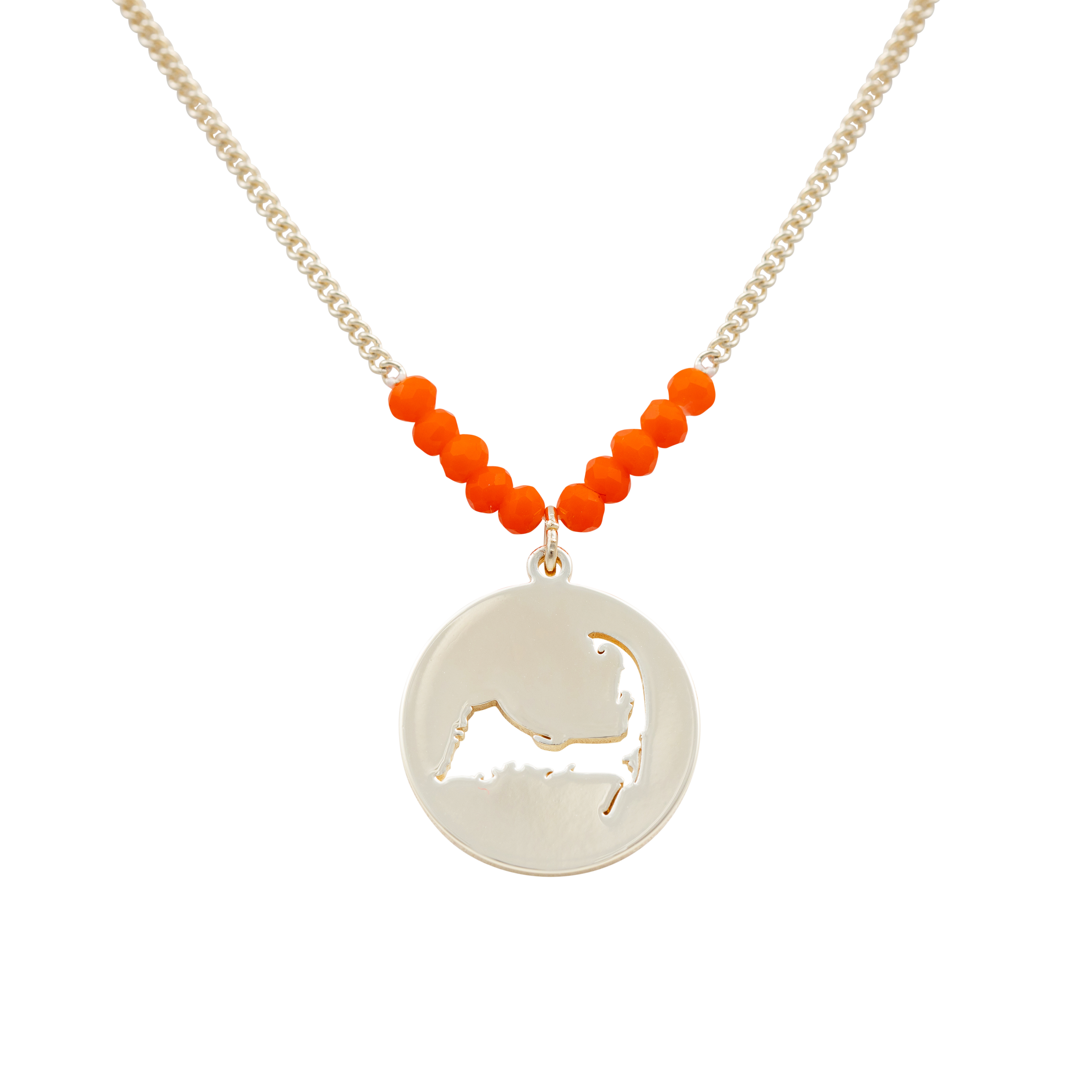 the beach and back cape cod necklace in gold with coral beads at center of chain and coin shape pendant with cutout silhouette of cape cod