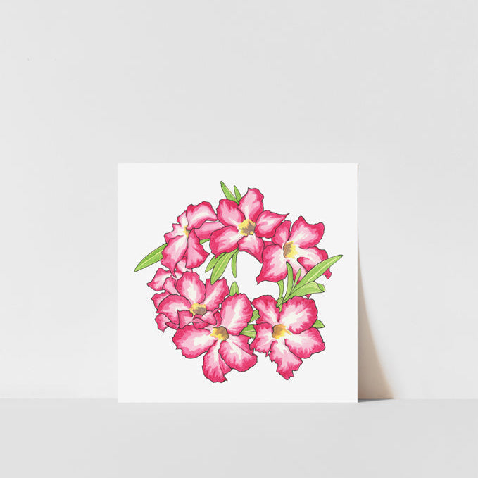 A printed artwork featuring a vibrant pink and green floral design, resembling a group of desert roses, presented against a white background.