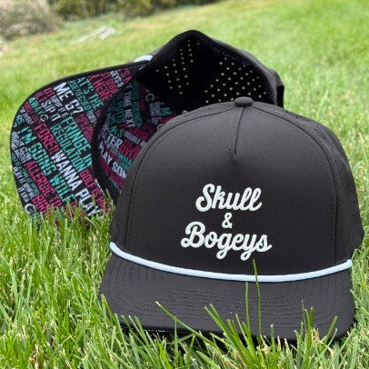 A black snapback cap with white embroidered text reading &