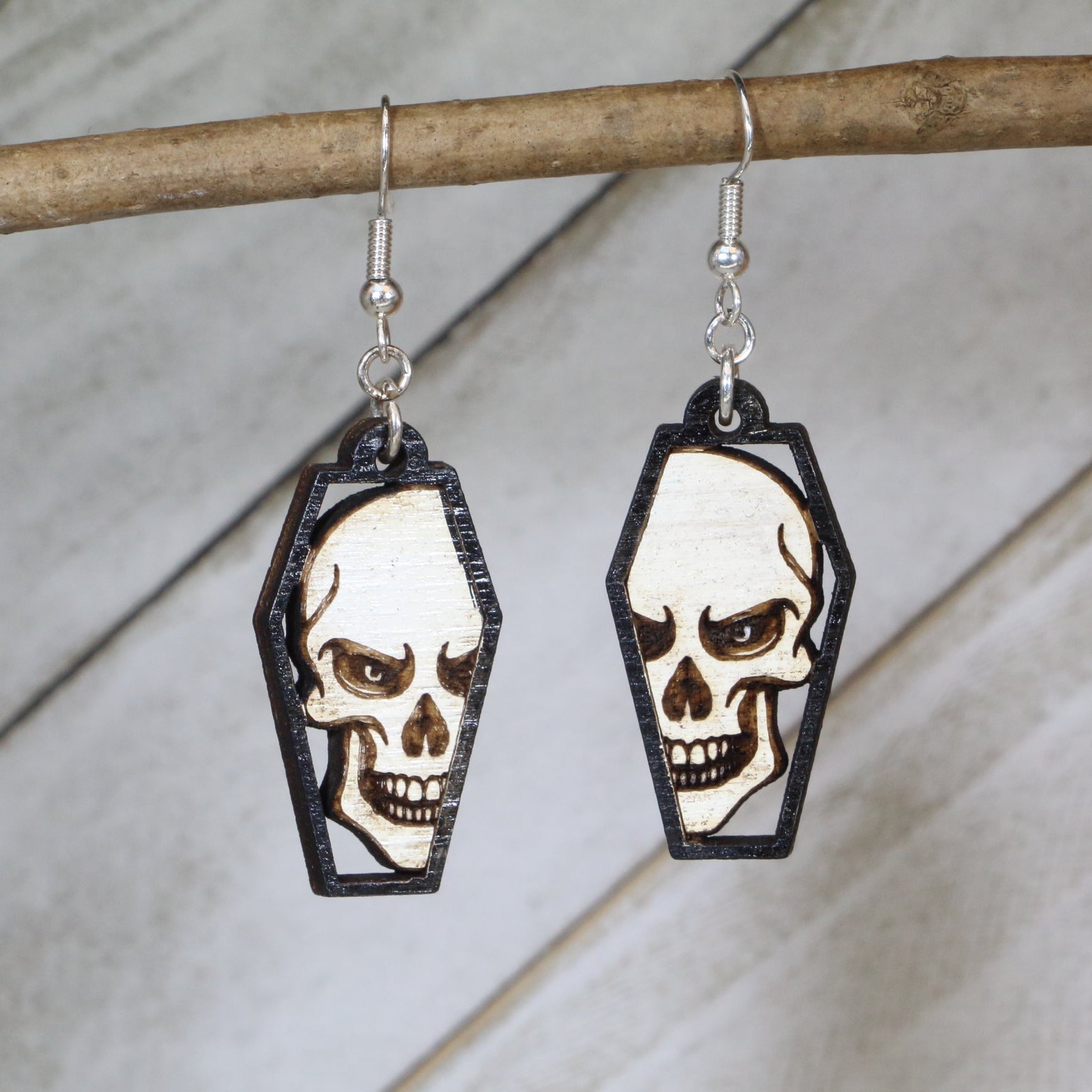 Hand-painted skull coffin wooden dangle earrings with gothic horror design, lightweight hypoallergenic spooky jewelry for Halloween lovers and dark fantasy fans