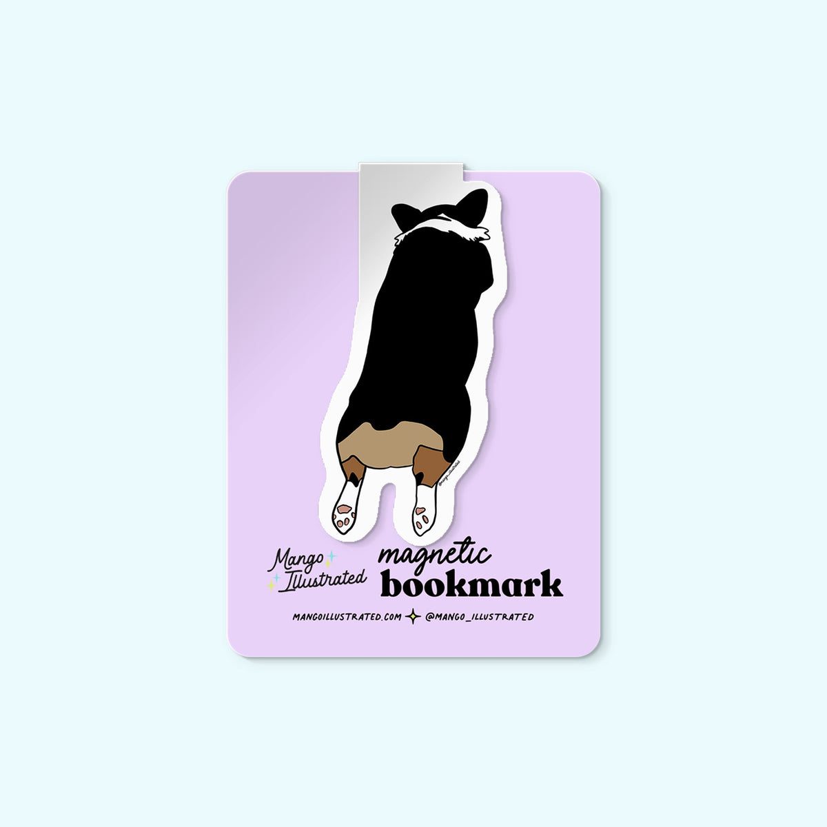 Corgi Sploot magnetic bookmark detail — illustrated corgi page marker on a book by indie artist MangoIllustrated