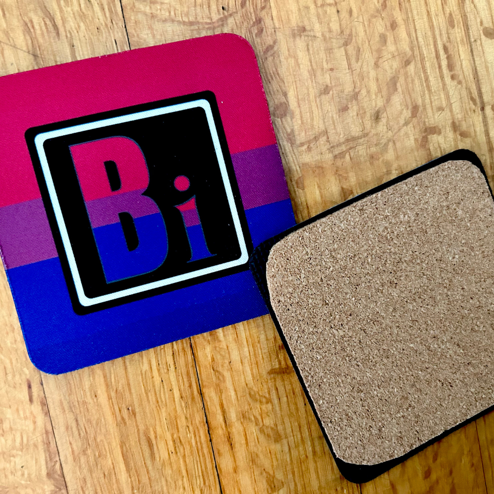 The Bisexual Element coaster. On the left is the front of the Bisexual element with the colors of the Bisexual flag. On the right is te back of our coasters, which have cork across the back of the coaster.