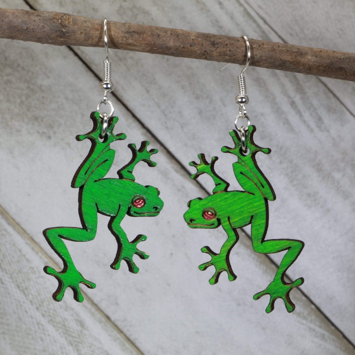 Hand-painted wooden tree frog dangle earrings with vibrant rainforest design and hypoallergenic sterling silver hooks, lightweight tropical frog statement jewelry earrings for nature lovers