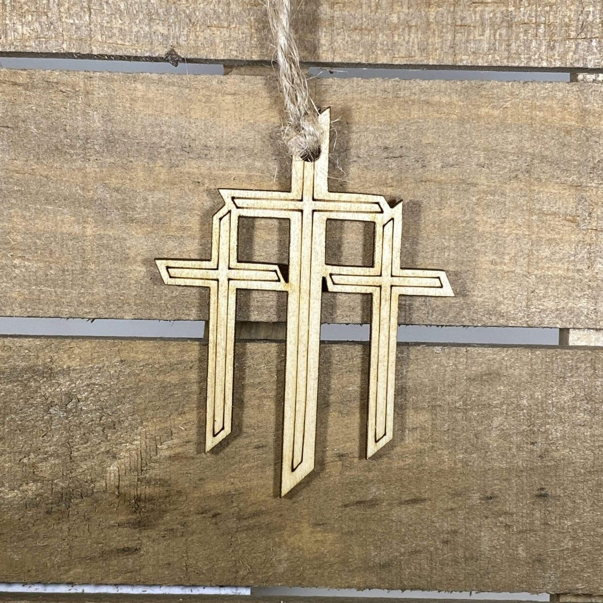 Hand-painted wooden triple cross Christmas ornament featuring three crosses with symbolic Christian design and rustic detailing, meaningful holiday decor for faith-based homes and religious celebrations by Cate’s Concepts