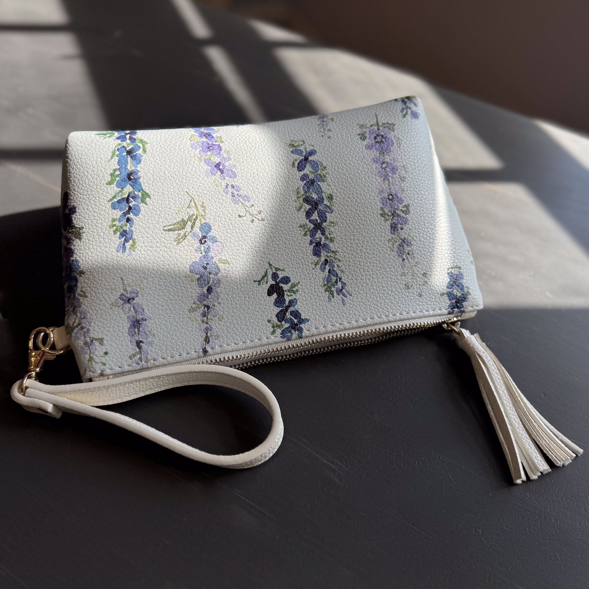 dancing delphinium clutch in vegan leather