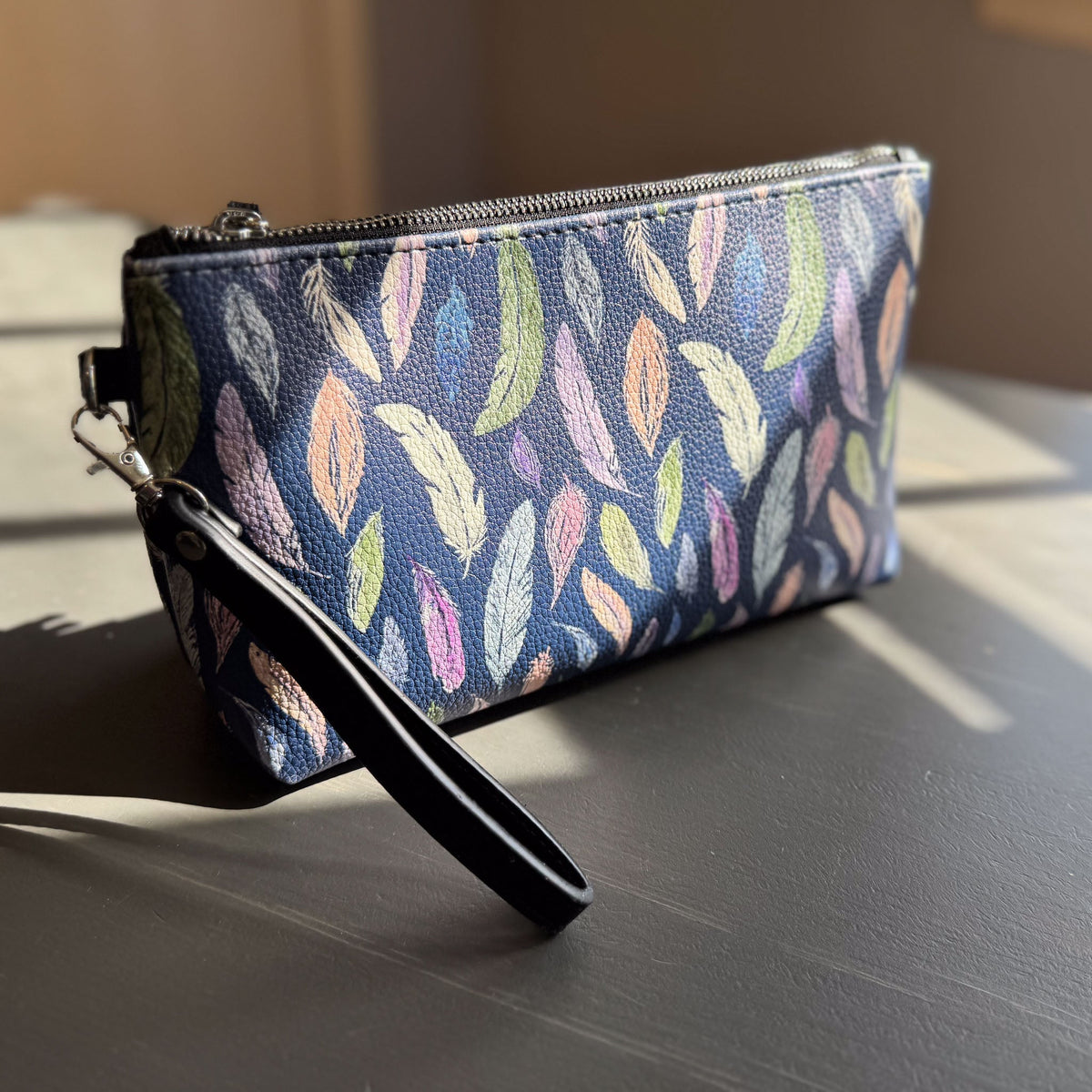 the featherlight clutch collection in vegan leather
