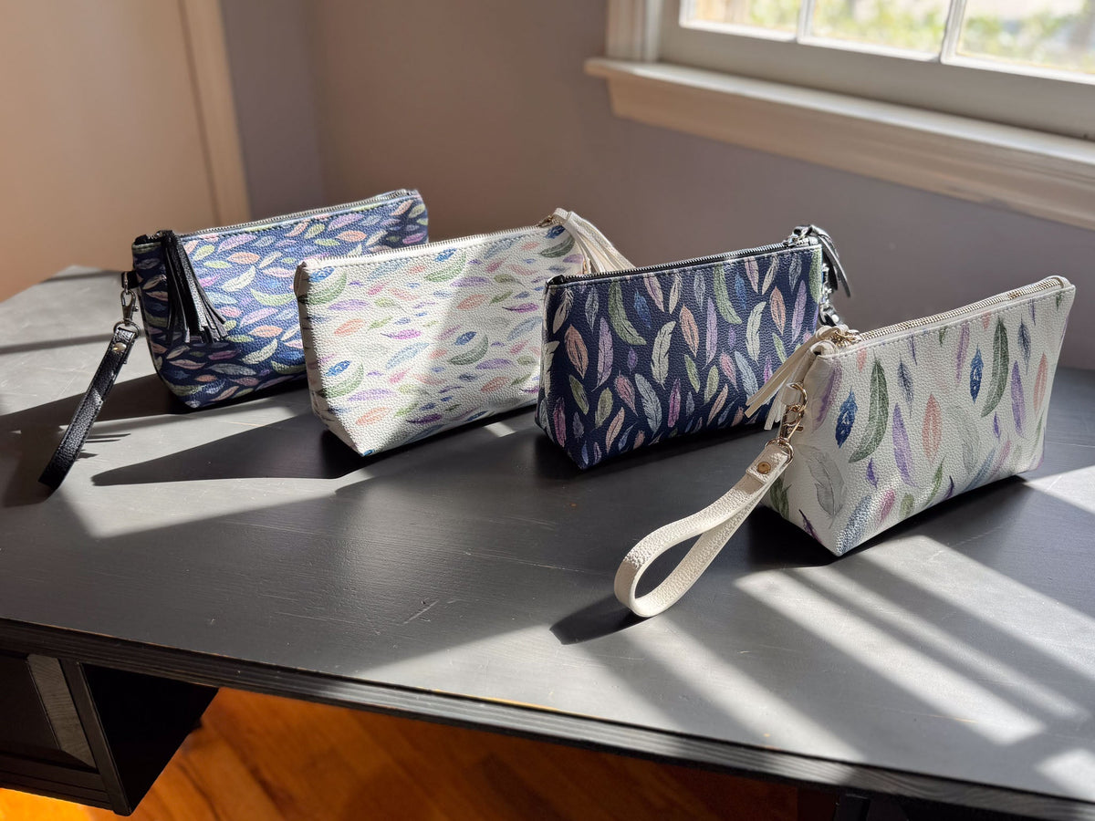 the featherlight clutch collection in vegan leather