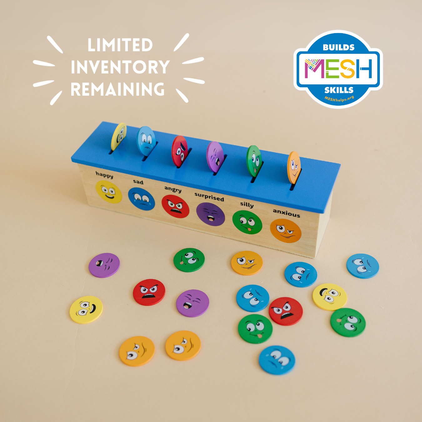 Emotions sorting game with colorful emotion coins and a wooden box on a beige background, featuring &