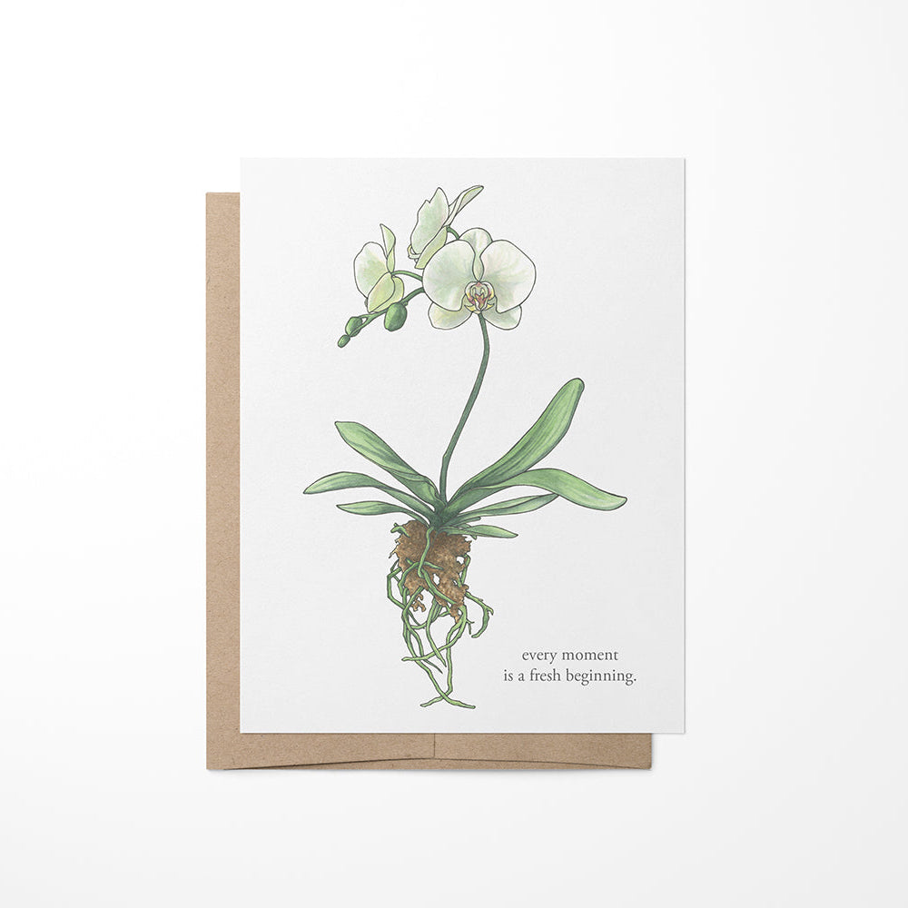 A greeting card featuring a white orchid with a quote on a white background, with a Kraft envelope.