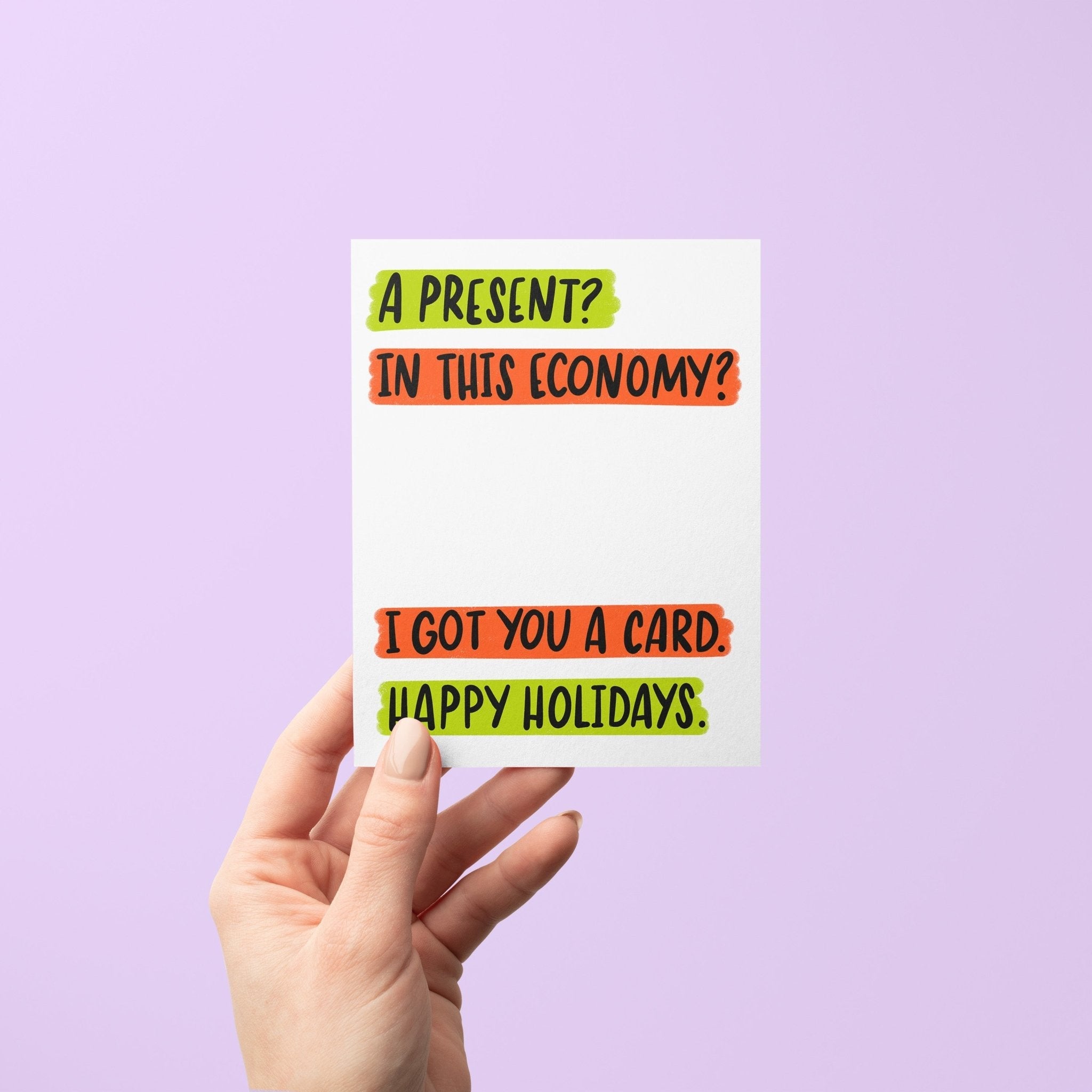 Humorous holiday greeting card with bold text that reads: “A present? In this economy? I got you a card. Happy Holidays.” in neon green and red blocks.