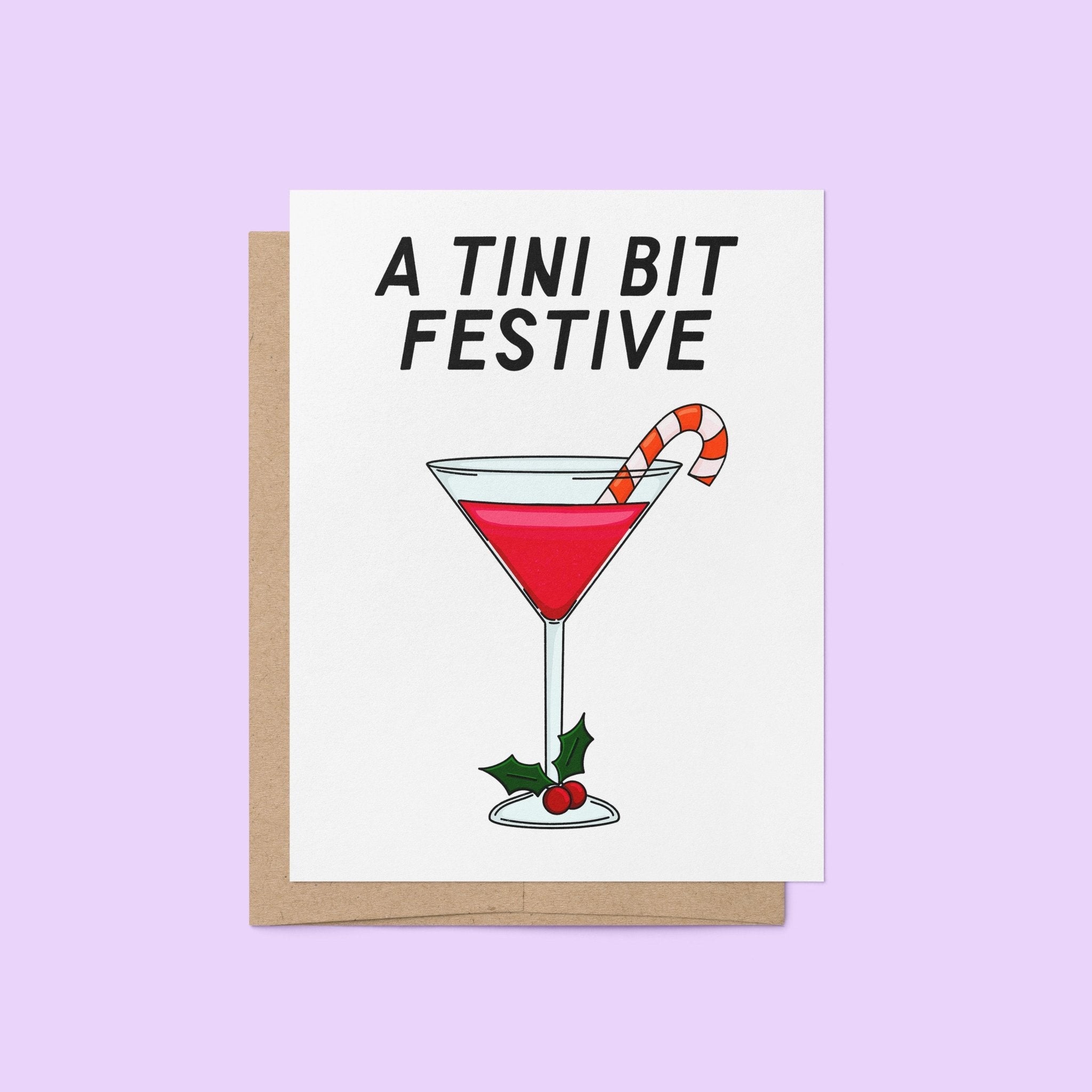 Illustrated holiday greeting card with a red martini, candy cane garnish, and holly, featuring the phrase "A Tini Bit Festive" in bold lettering.