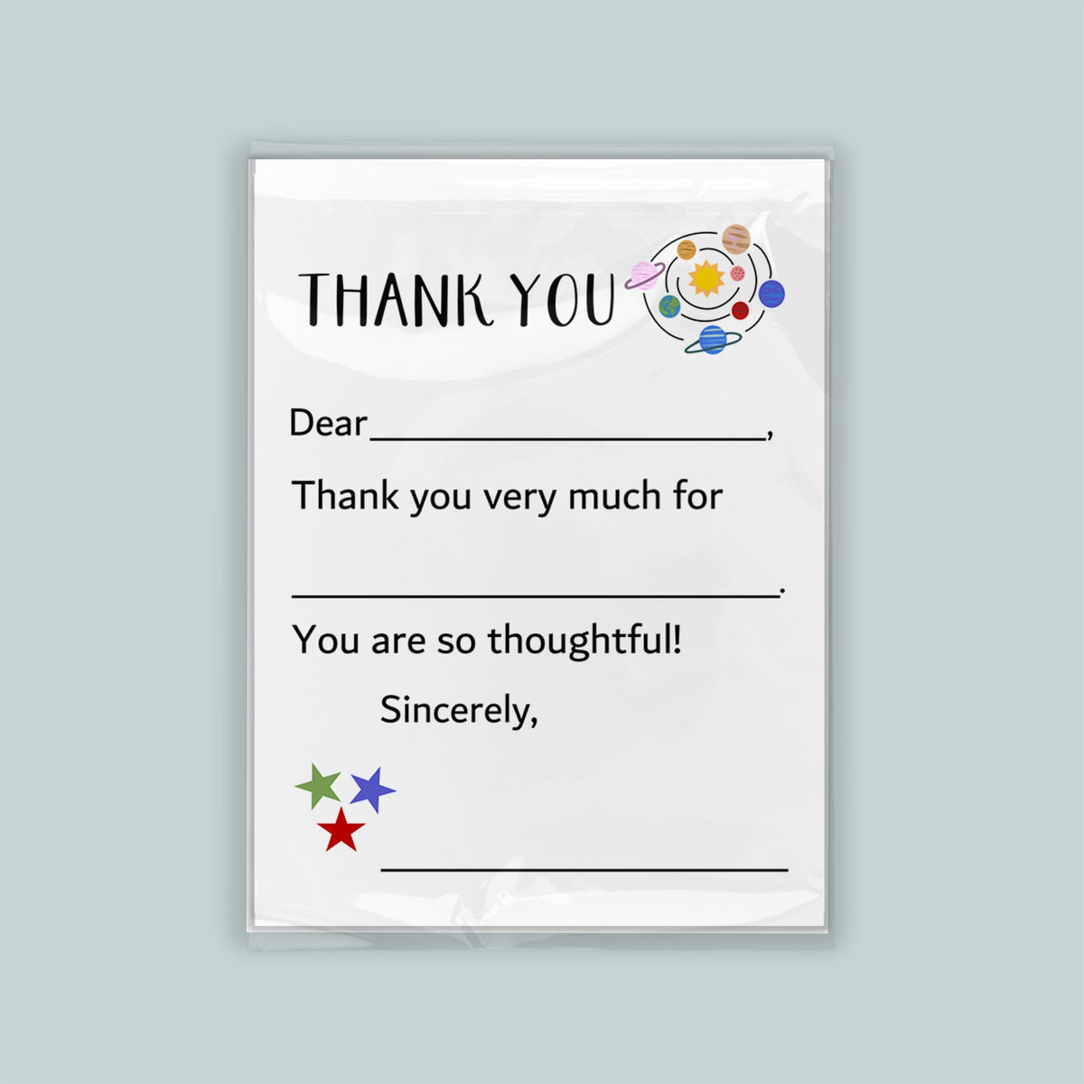 The image is a white thank you card with a space-themed design, including planets and stars. The card has a blank space for a recipient&