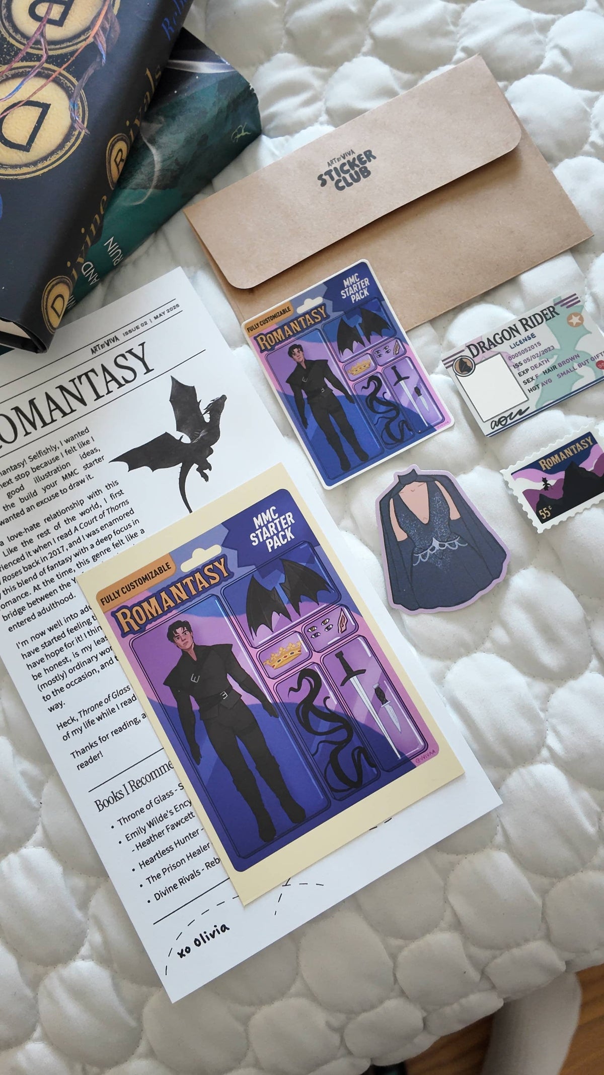 Collection of fantasy-themed cards and a letter on a textured surface